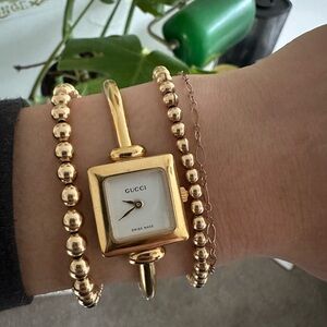 90s Gold-Plated Stainless Steel Gucci Beswick Bangle Watch with Square Dial